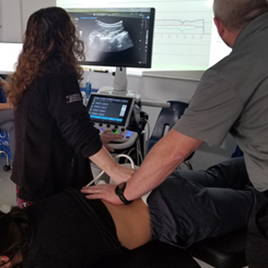 image Richmond chiropractic ultrasound imaging of spinal vertebrae during treatment